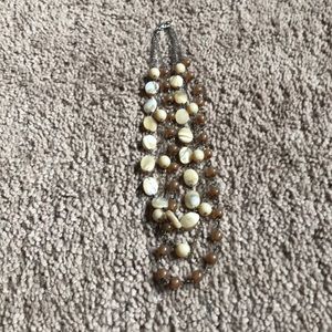 Multi string tan and cream necklace